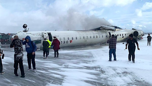 Delta plane flips upside down in crash at Toronto airport as crews race