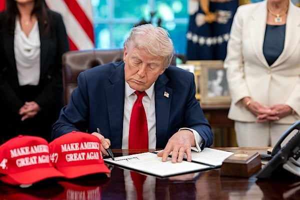 President Donald Trump signs executive orders alongside Secretary of Education Linda McMahon and wounded warriors in the Oval Office, Wednesday, April 23, 2025. (Official White House photo by Molly Riley)