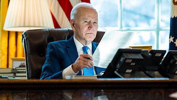 Joe Biden talks on the phone with King Salman of Saudi Arabia Wednesday, Feb. 9, 2022, in the Oval Office of the White House. (Official White House photo by Adam Schultz)