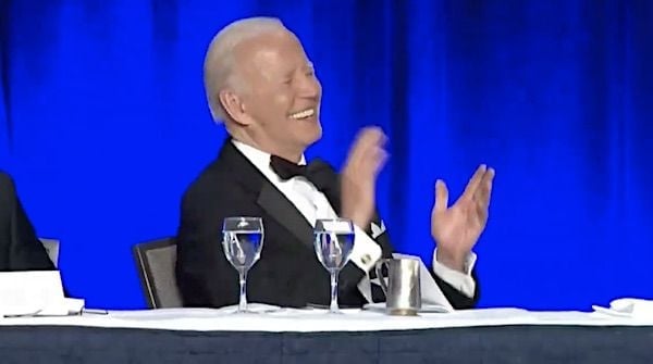 Joe Biden laughs during the White House Correspondents dinner on Saturday, April 30, 2022. (Video screenshot)