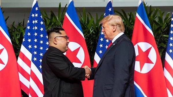 President Donald J. Trump and North Korean leader Kim Jong Un, shake hands as they meet for the first time, Tuesday, June 12, 2018, at the Capella Hotel in Singapore. (Official White House Photo by Shealah Craighead)