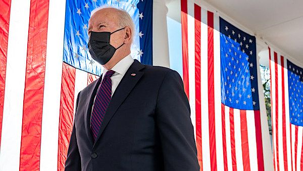 President Joe Biden walks past draped America flags along the Colonnade of the White House, Monday, Nov. 15, 2021, en route to sign the Infrastructure Investment and Jobs Act. (Official White House photo by Adam Schultz)