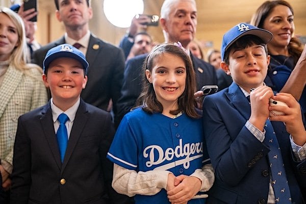 Children listen as President Donald Trump delivers remarks at an event celebrating the 2024 World Series Champion Los Angeles Dodgers, Monday, April 7, 2025, in the East Room of the White House. (Official White House photo)