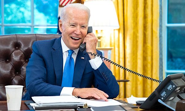President Joe Biden talks on the phone with James Murray, director of the U.S. Secret Service on Monday, July 12, 2021, in the Oval Office of the White House. (Official White House photo by Adam Schultz)