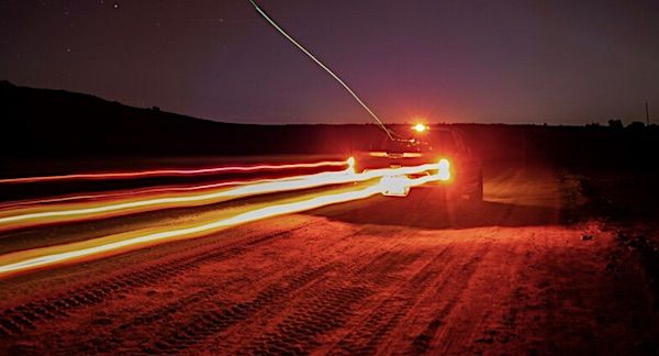 Testers land a drone on a moving truck to test its capabilities during night time operations on East Marine Corps Air Station Miramar, California, Jan. 24. 2019. (U.S. Marine Corps photo by Sgt. Jake McClung)