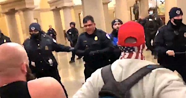 Protesters confront police inside the U.S. Capitol on Wednesday, Jan. 6, 2021. (Video screenshot)