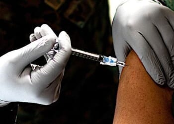 A U.S. Navy corpsman administers a U.S. Marine with the Pfizer-BioNTech COVID-19 vaccine on Camp Lejeune, North Carolina, Jan. 15, 2021. (U.S. Marine Corps photo by Cpl. Rachel K. Young-Porter)