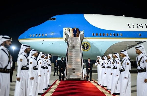 President Donald Trump awaits the arrival of Qatar's Emir Sheikh Tamim bin Hamad Al-Thani and Prime Minister and Foreign Minister Sheikh Mohammed bin Abdulrahman bin Jassim Al-Thani for a meeting aboard Air Force One during a refueling stop in Doha, Qatar, Saturday, Oct. 25, 2025. (Official White House photo by Daniel Torok)