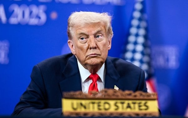 President Donald Trump looks on as Malaysian Prime Minister Seri Anwar Ibrahim delivers remarks before signing the Kuala Lumpur Accord, Sunday, Oct. 25, 2025, at the ASEAN Summit in Kuala Lumpur, Malaysia. (Official White House photo by Daniel Torok)