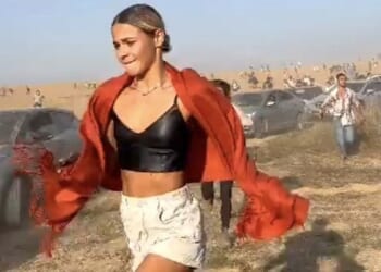 A young woman attending a concert in Israel flees as Hamas terrorists open fire on Saturday, Oct. 7, 2023 (Video screenshot)