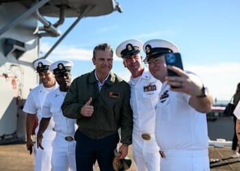 Secretary of War Pete Hegseth poses for photos with sailors before President Donald Trump delivers remarks at the U.S. Navy 250th anniversary celebration at Naval Station Norfolk in Norfolk, Virginia, Sunday, Oct. 5, 2025. (Official White House photo by Daniel Torok)