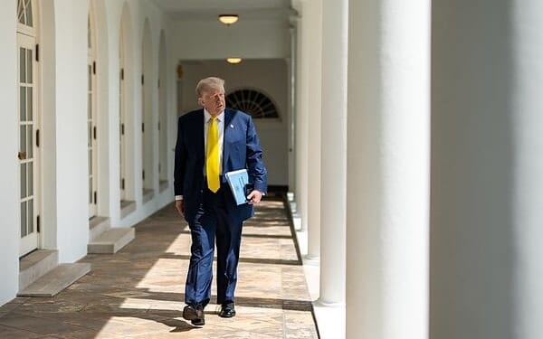 President Donald Trump walks on the West Colonnade to the Oval Office, Monday, July 21, 2025. (Official White House photo by Molly Riley)