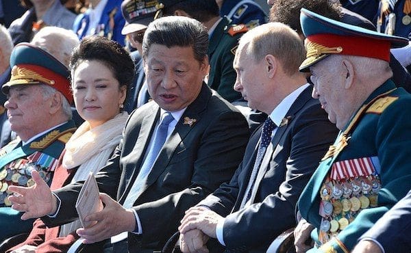 Chinese President Xi Jinping with Russian President Vladimir Putin during the Moscow Victory Day Parade May 9, 2015 (Wikimedia Commons)