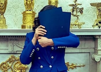 Gov. Gretchen Whitmer, D-Mich., hides her face from news media during an Oval Office meeting with President Donald Trump on Wednesday, April 9, 2025 (X)