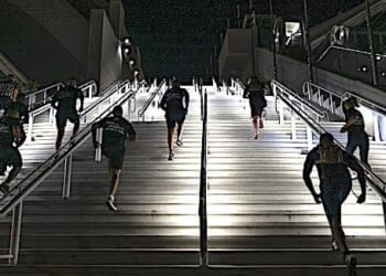 United States Marines assigned to the 12th Marine Corps District run up stairs during a stair walk at the San Diego Convention Center, San Diego, Calif., Sept. 11, 2020. The Marines simulated walking up and down one World Trade Center tower by traversing 110 flights of stairs. (U.S. Marine Corps photo by Sgt. Christian Cachola)
