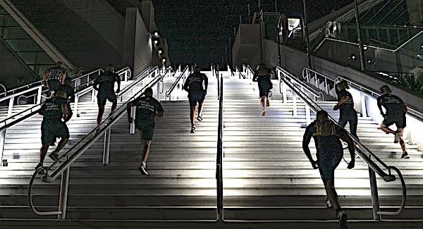 United States Marines assigned to the 12th Marine Corps District run up stairs during a stair walk at the San Diego Convention Center, San Diego, Calif., Sept. 11, 2020. The Marines simulated walking up and down one World Trade Center tower by traversing 110 flights of stairs. (U.S. Marine Corps photo by Sgt. Christian Cachola)