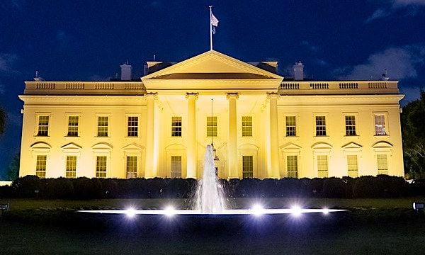 The White House is illuminated in gold light in recognition of Childhood Cancer Awareness Month, Thursday, Sept. 23, 2021. (Official White House photo by Erin Scott)
