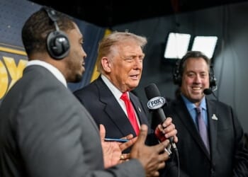 President Donald Trump calls the game alongside Kenny Albert and Jonathan Vilma in the Fox NFL broadcast booth as the Washington Commanders take on the Detroit Lions at Northwest Stadium in Landover, Maryland, Sunday, Nov. 9, 2025. (Official White House photo by Daniel Torok)