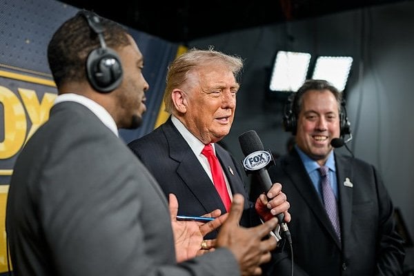 President Donald Trump calls the game alongside Kenny Albert and Jonathan Vilma in the Fox NFL broadcast booth as the Washington Commanders take on the Detroit Lions at Northwest Stadium in Landover, Maryland, Sunday, Nov. 9, 2025. (Official White House photo by Daniel Torok)