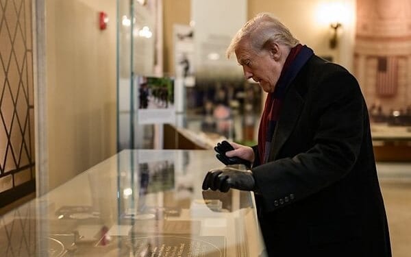 President Donald Trump looks at a display in the Memorial Display Room at Arlington National Cemetery in Arlington, Virginia during Veterans Day ceremonies, Tuesday, Nov. 11, 2025. (Official White House photo by Daniel Torok)