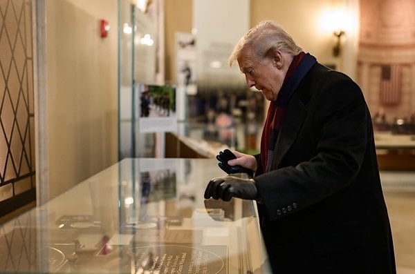 President Donald Trump looks at a display in the Memorial Display Room at Arlington National Cemetery in Arlington, Virginia during Veterans Day ceremonies, Tuesday, Nov. 11, 2025. (Official White House photo by Daniel Torok)