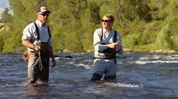 U.S. Sen. Michael Bennet, D-Colo., right, goes fishing in a campaign ad debuting in August 2022. (Video screenshot)