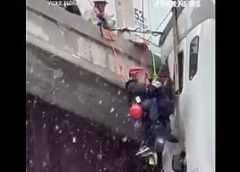 Truck driver rescued dangling off highway 100-feet above the ground * WorldNetDaily * by WND Staff