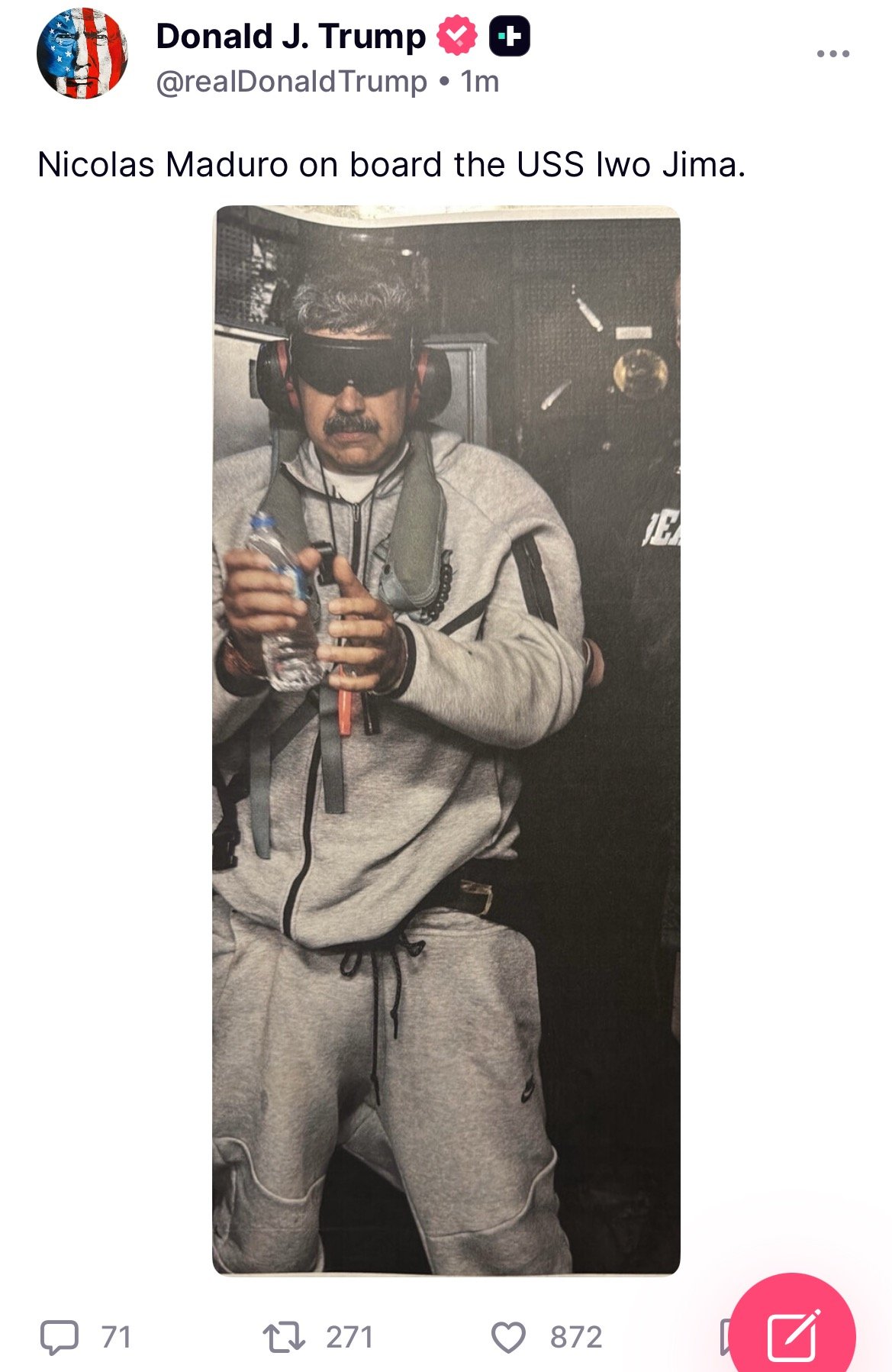 Nicolas Maduro wearing a headset and holding a water bottle on board the USS Iwo Jima.