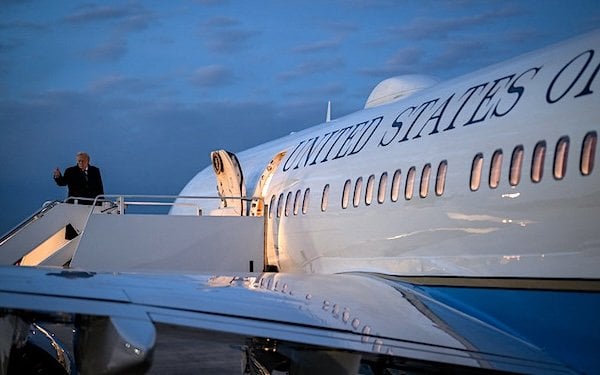 President Donald Trump boards Air Force One at Joint Base Andrews, Maryland, en route Wilkes-Barre Scranton International Airport for a rally on the economy in Mount Pocono, Pennsylvania, Tuesday, Dec. 9, 2025. (Official White House photo by Molly Riley)