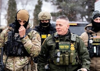 Border Patrol Commander Greg Bovino walks alongside BORTAC officers at a Speedway gas station in Minneapolis on Thursday, Jan. 22, 2026. ((Photo by Chad Davis)