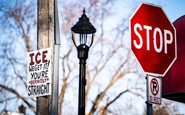 A sign up high on a Minneapolis utility pole that reads 'ICE WE GET IT! YOU'RE DEFINITELY STRAIGHT' on Monday, Jan. 26, 2026. (Photo by Chad Davis)