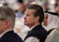 U.S. Defense Secretary Pete Hegseth listens as President Donald Trump gives remarks during an official State Dinner at Lusail Palace in Doha, Qatar, Wednesday, May 14, 2025. (Official White House photo by Daniel Torok)