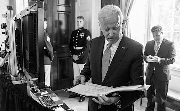 Joe Biden reviews his remarks before an event marking the one-year anniversary of the Inflation Reduction Act, Wednesday, Aug. 16, 2023, in the Green Room of the White House. (Official White House photo by Adam Schultz)