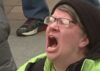 The now iconic anti-Trump protester. (Video screenshot)