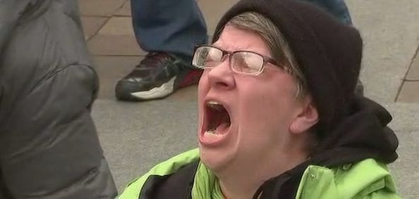 The now iconic anti-Trump protester. (Video screenshot)