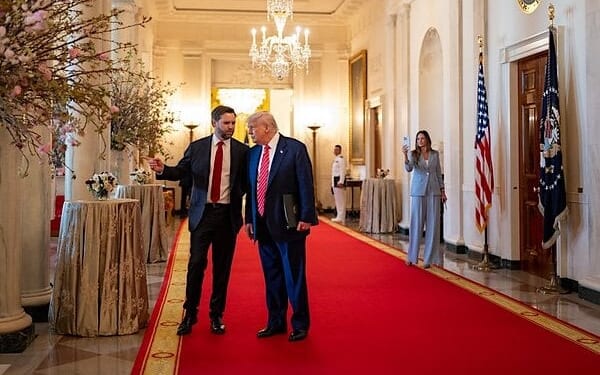 President Donald Trump and Vice President JD Vance talk in the Cross Hall of the White House, Thursday, May 8, 2025. (Official White House photo by Molly Riley)