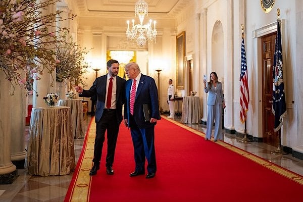 President Donald Trump and Vice President JD Vance talk in the Cross Hall of the White House, Thursday, May 8, 2025. (Official White House photo by Molly Riley)