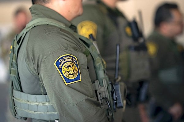 Secretary of Homeland Security Kristi Noem visits with officers from U.S. Immigration and Customs Enforcement, U.S. Customs and Border Protection, and the Federal Protective Service at the ICE facility in Portland, Oregon, to observe enforcement operations, Tuesday, Oct. 7, 2025. (DHS photo by Tia Dufour)