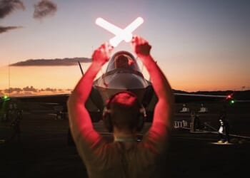 An Air Force crew chief guides in an F-35A Lightning II following actions in Venezuela in support of Operation Absolute Resolve, Jan. 3, 2026. (U.S. Air Force photo)