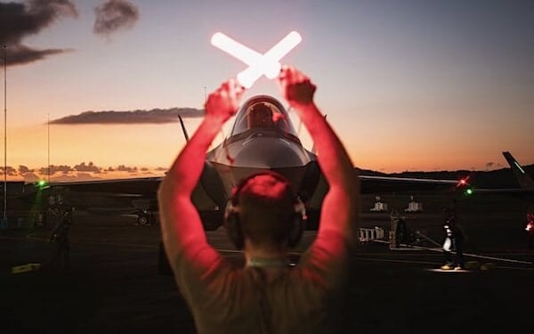 An Air Force crew chief guides in an F-35A Lightning II following actions in Venezuela in support of Operation Absolute Resolve, Jan. 3, 2026. (U.S. Air Force photo)