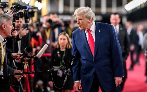President Donald Trump speaks to members of the media after his arrival to the John F. Kennedy Center for the Performing Arts in Washington, D.C. on Friday, Dec. 5, 2025, to attend the FIFA World Cup drawing. (Official White House photo by Daniel Torok)