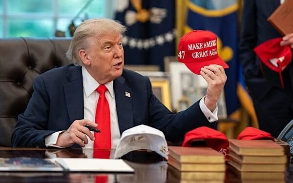 President Donald Trump exchanges gifts with German Chancellor Friedrich Merz, Thursday, June 5, 2025, in the Oval Office. (Official White House photo by Daniel Torok)