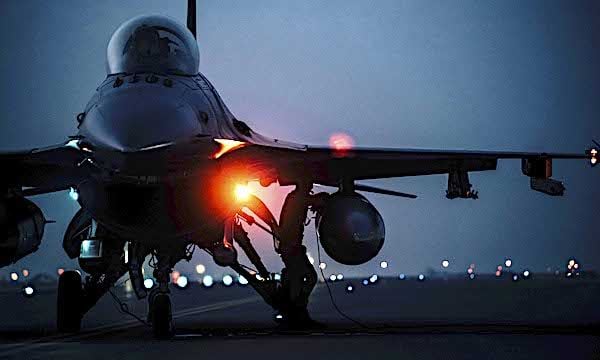 Airmen conduct a hot refueling on an Air Force F-16 Fighting Falcon aircraft at Al Udeid Air Base, Qatar, March 1, 2021, in order to rapidly redeployment to the U.S. Central Command’s area of responsibility. (U.S. Air National Guard photo by Staff Sgt. Jordan Martin)