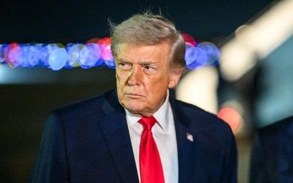 President Donald Trump speaks to press before boarding Air Force One at Miami International Airport in Miami, Florida on Monday, Jan. 19, 2026, en route to Joint Base Andrews, Maryland. (Official White House photo by Daniel Torok)