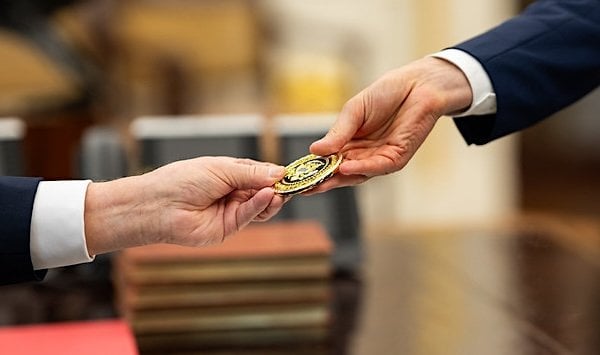 President Donald Trump exchanges gifts with German Chancellor Friedrich Merz, Thursday, June 5, 2025, in the Oval Office. (Official White House photo by Daniel Torok)