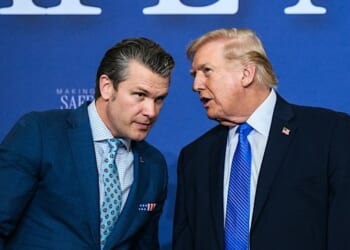 President Donald J. Trump speaks with U.S. Secretary of War Pete Hegseth at the Memphis Safe Task Force roundtable on public safety at Tennessee Air National Guard Base, Tennessee, on Monday, March 23, 2026. (Official White House photo by Molly Riley)
