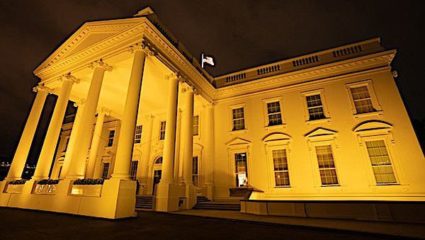 The White House is seen lit in recognition of Childhood Cancer Awareness Month Tuesday, Sept. 1, 2020. (Official White House photo by Andrea Hanks)