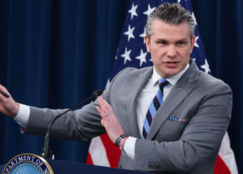 Secretary of War Pete Hegseth speaks to reporters in the Pentagon.