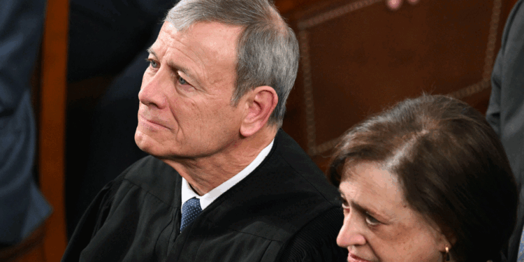 L/R) Supreme Court Chief Justice John Roberts and Supreme Court Justice Elena Kagan listen as US President Donald Trump delivers the State of the Union address in the House Chamber of the US Capitol in Washington, DC, on February 24, 2026. (Photo by Mandel NGAN / AFP via Getty Images)