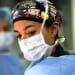 Lt. Cmdr. Marissa Mayor, a general surgeon with Fleet Surgical Team 7, observes her patient prior to conducting a surgical walkthrough during a mass casualty drill to assess skills and coordination between integrated units aboard the amphibious assault ship USS America in the Philippine Sea, June 18, 2021. (U.S. Marine Corps photo by Cpl. Karis Mattingly)